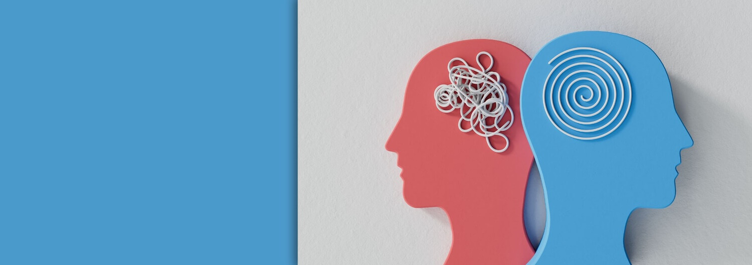 Zwei Köpfe – einer mit einem wirren Gedankenknäuel, einer mit einer sauber gedrehten Spirale. Es soll ein Sinnbild für die Wichtigkeit der Gesundheitspsychologie sein.